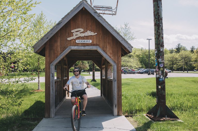 Burton employee on a bicycle