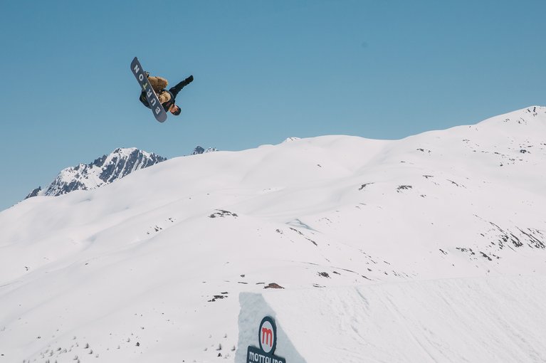 Ben Ferguson hitting a jump on the Burton Custom