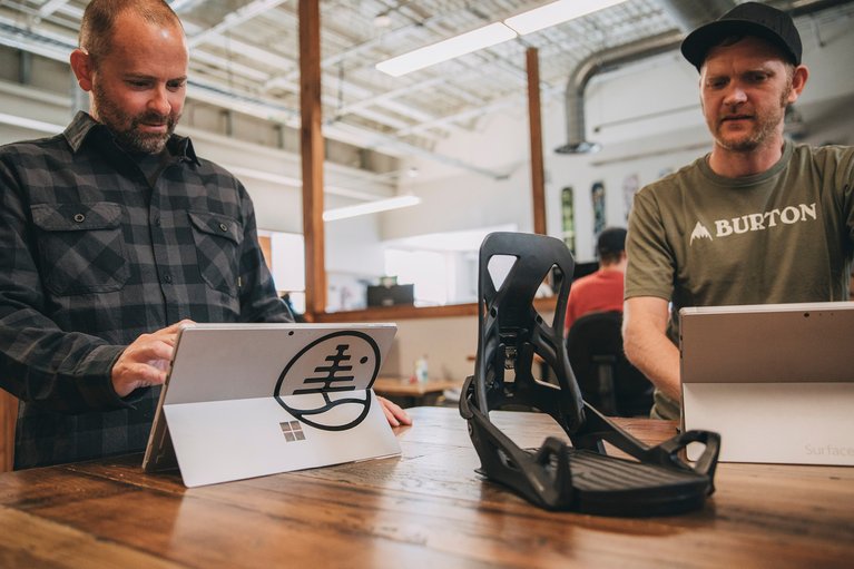 Burton employees working on product with microsoft surface