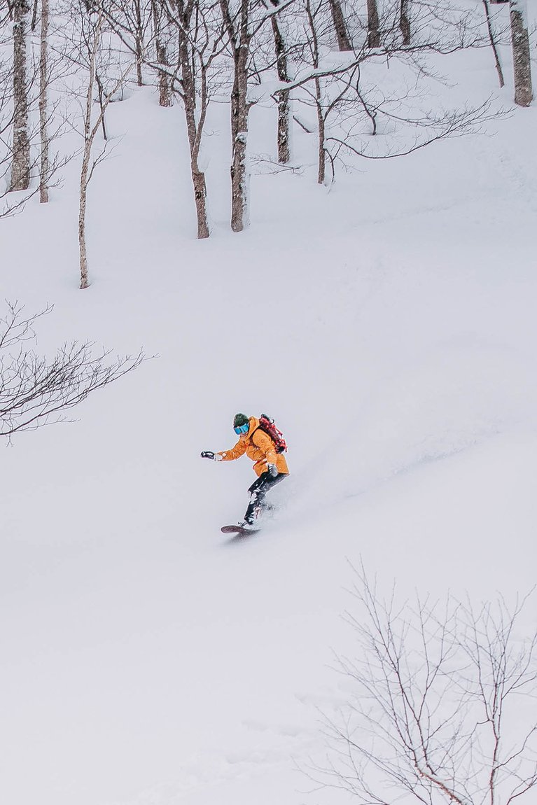 Christine Savage riding in powder in Japan