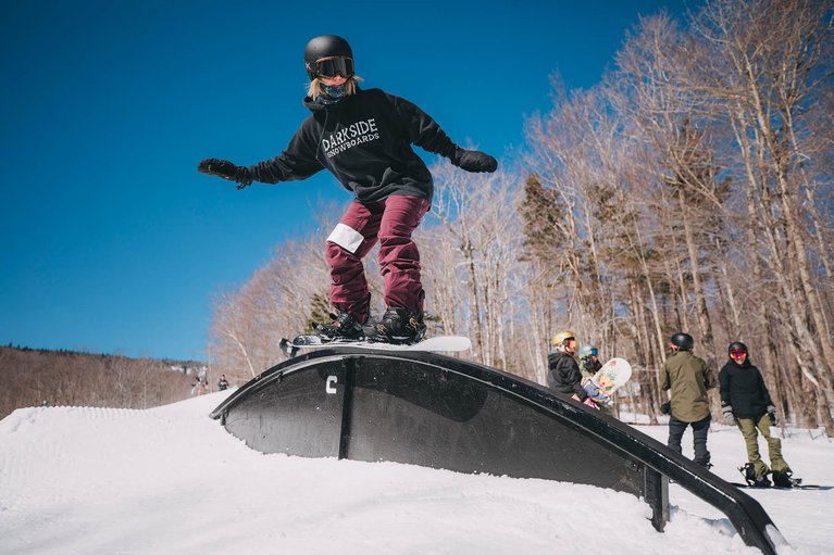 Burton employee, Ally Healy, hitting a rainbow rail