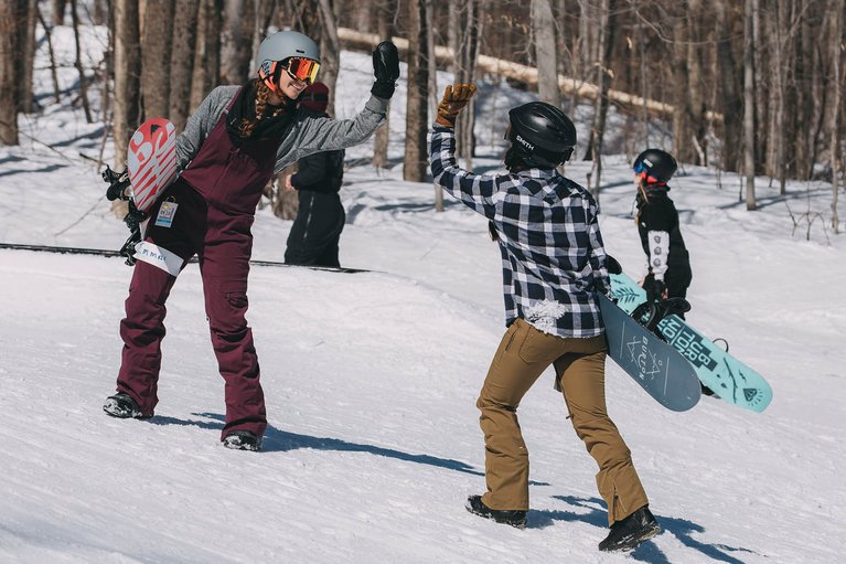 Two women high-fiving