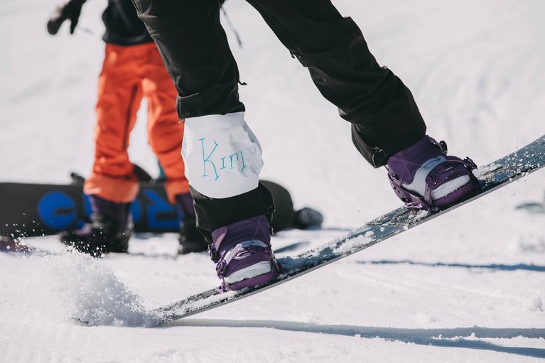 Burton employee, Kim Dirmaier learning to tail press her board