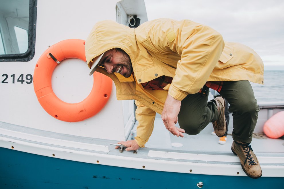 Danny Davis jumping out of a boat.