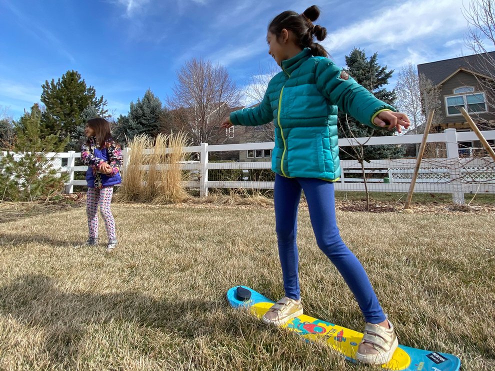 Backyard snowboarding - Emma pulls Sophie on the Riglet pulling .jpg