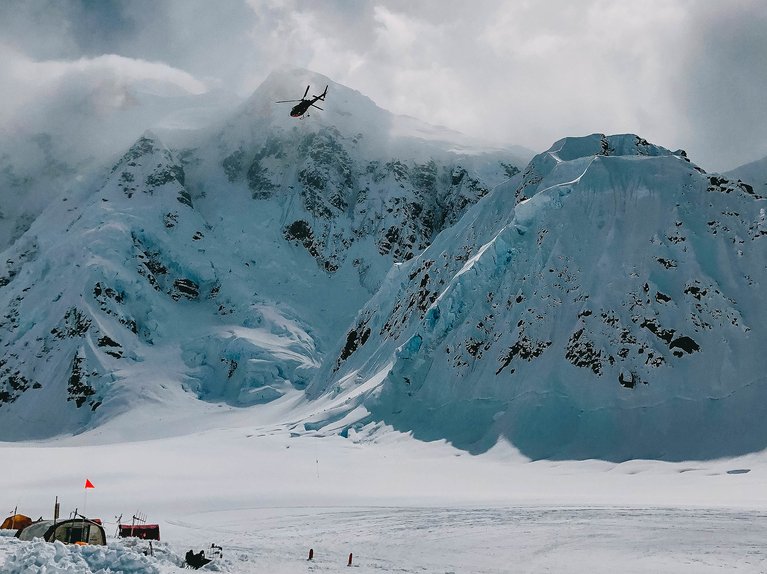 Helicopter flying over mountains