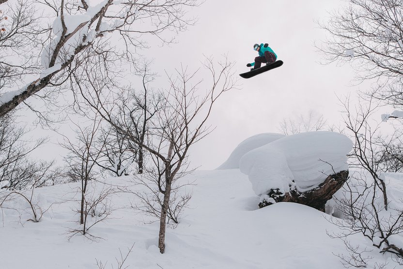 Kimmy Fasani, frontside 540 off the pillow and over the trees.